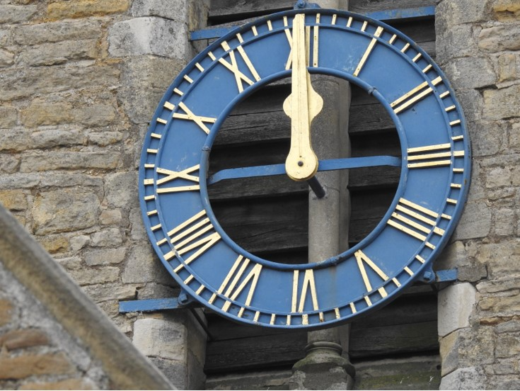 Clock showing midday.
